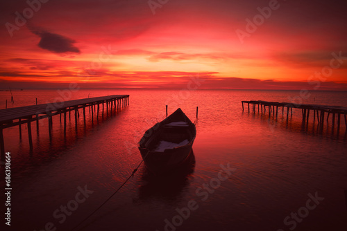 boat at sunrise on the lake