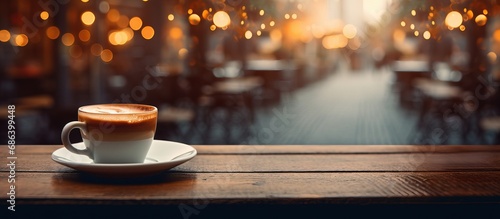 Bokeh image of blurred cafe background with coffee shop