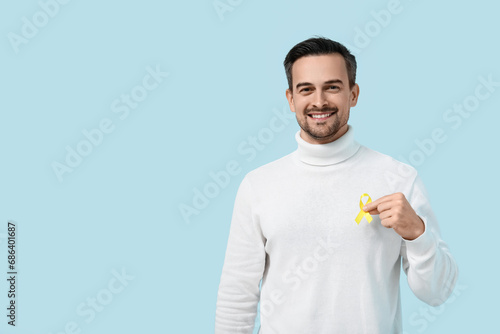 Handsome adult man with yel...