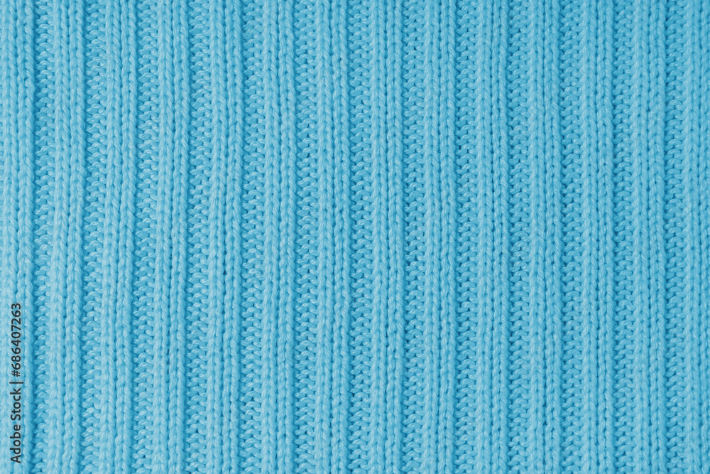 Jersey textile background , cyan striped knitted fabric. Woolen knitwear, sweater, pullover surface texture, textile structure, cloth surface, weaving of knitwear material. Wallpaper, backdrop. Jersey textile background , cyan striped knitted fabric. Woolen knitwear, sweater, pullover surface texture, textile structure, cloth surface, weaving of knitwear material. Wallpaper, backdrop.