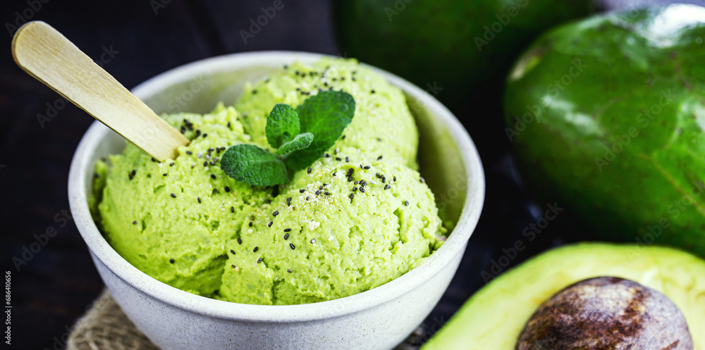 homemade avocado ice cream, made with frozen organic fruits with no added sugar or dairy. Vegan dessert. Dessert served in biodegradable plastic bowl. homemade avocado ice cream, made with frozen organic fruits with no added sugar or dairy. Vegan dessert. Dessert served in biodegradable plastic bowl.