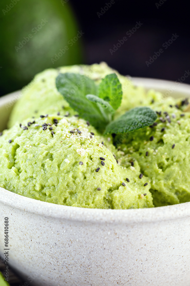 homemade avocado ice cream, made with frozen organic fruits with no added sugar or dairy. Vegan dessert. Dessert served in biodegradable plastic bowl. homemade avocado ice cream, made with frozen organic fruits with no added sugar or dairy. Vegan dessert. Dessert served in biodegradable plastic bowl.