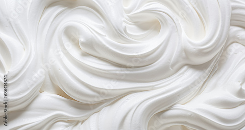 a white whipped or sour cream on white background, close up, top view.