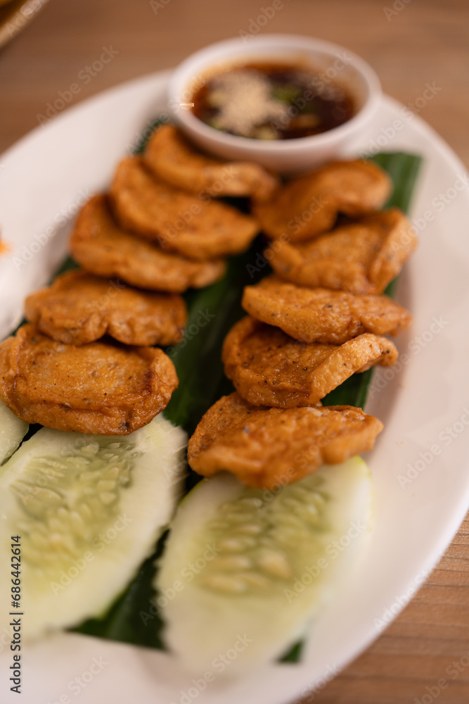 Fried Vietnamese pork sausage on banana leaf. Asian food concept food appetizer in Thai called Moo Yor Fried Vietnamese pork sausage on banana leaf. Asian food concept food appetizer in Thai called Moo Yor