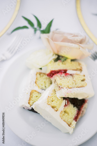 Wedding cake slices on elegant tablescape with rose