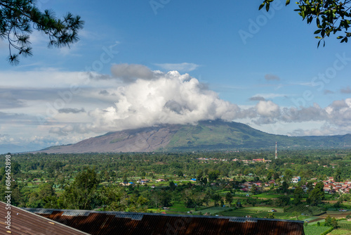 Sinabung active volcano during sunrise at Karo, Indonesia. Landscae of Sinabung mountain at the morning. photo