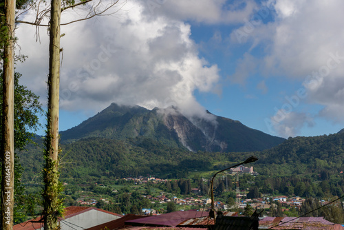 Sibayak active volcano during sunrise at Karo, Indonesia. Landscae of Sibayak mountain at the morning. photo