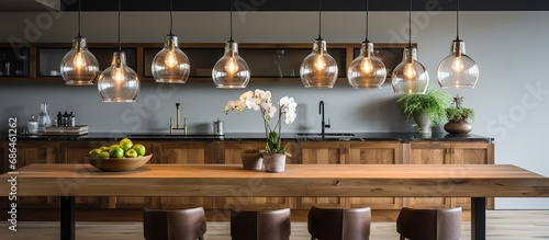 Contemporary pendant lighting above wooden island in kitchen