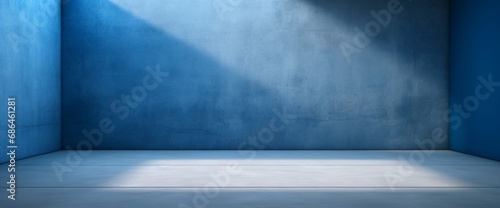 Blue concrete wall and floor with light and shadow backgrounds, use for product display for presentation and cover banner design