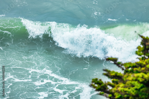 Wave splashing close-up. Crystal clear sea water, in the ocean in San Francisco Bay, blue water, pastel colors.