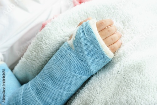 Children hand bone broken from accident with arm splint photo