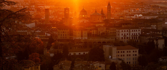 Keuken achterwand Bruin Bergamo, Italy. One of the beautiful city in Italy. Morning landscape at the old town from Saint Vigilio hill during fall season. Orange and red contest  © Matteo Ceruti