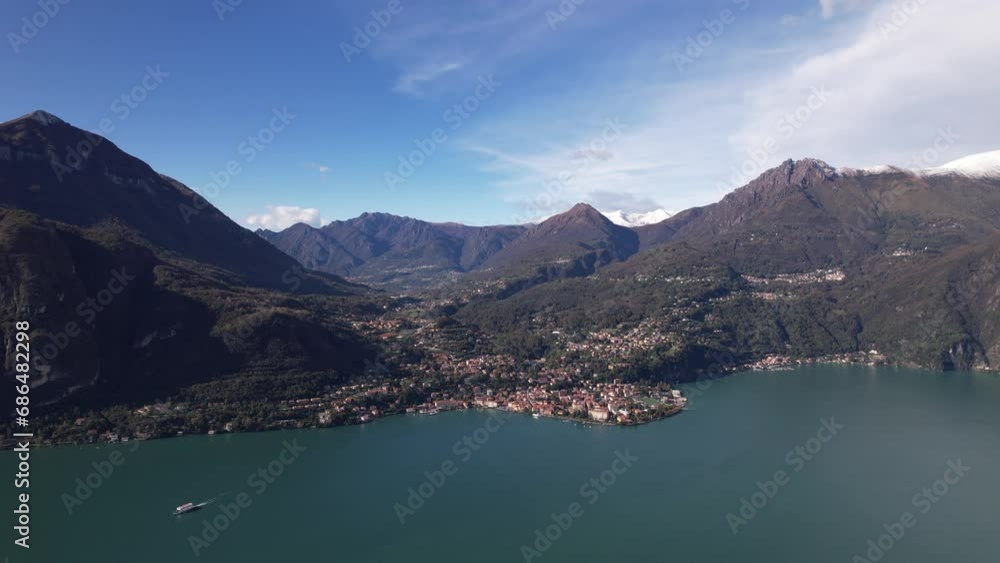 A Majestic Lake Surrounded by Towering Mountains in Breathtaking Aerial View A Majestic Lake Surrounded by Towering Mountains in Breathtaking Aerial View