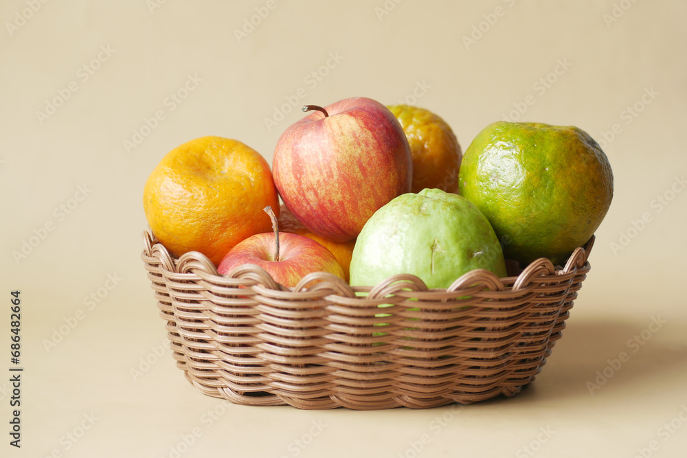Ripe fruits and berries in wicker basket Ripe fruits and berries in wicker basket