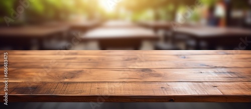 Blurry background with wooden table in closeup view