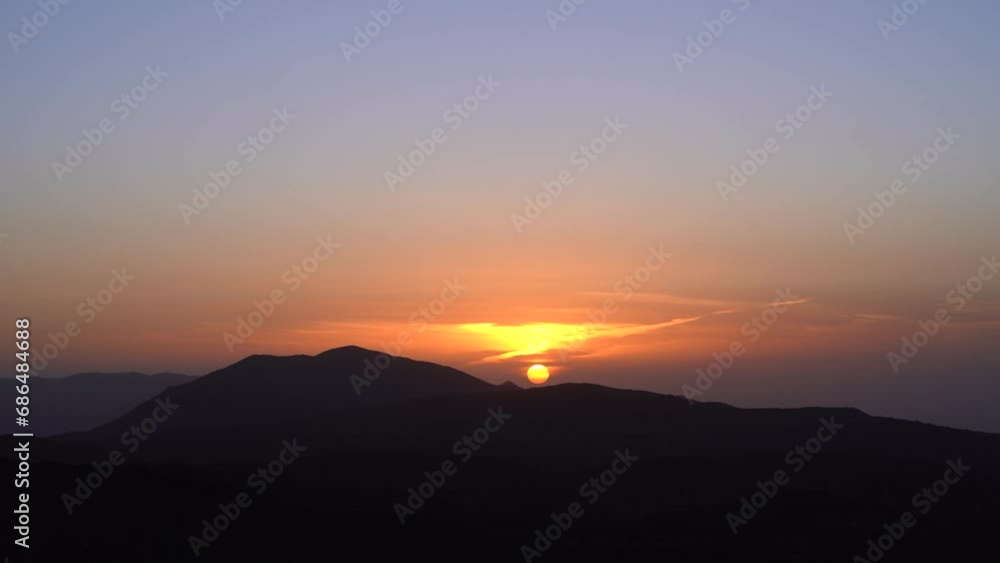 Stunning Aerial Timelapse of a Radiant Sunset Behind Majestic Mountains 4K Breathtaking Sky Colors and Serene Mountain Silhouettes Stunning Aerial Timelapse of a Radiant Sunset Behind Majestic Mountains 4K Breathtaking Sky Colors and Serene Mountain Silhouettes
