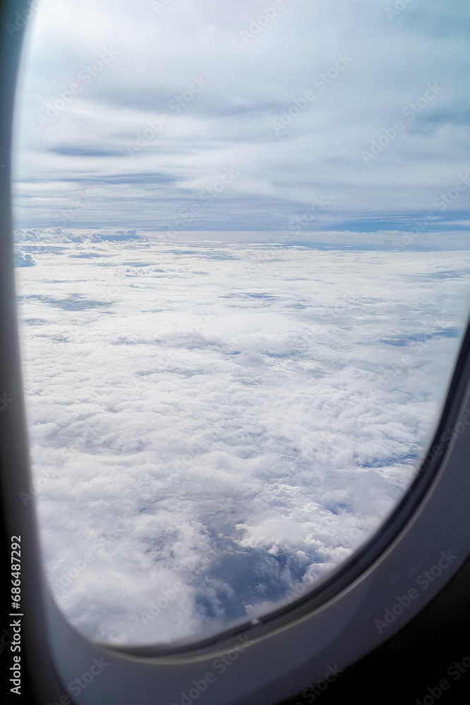 Clouds background scenic sky nature view from an airplane window during flight. Travel concept, Flight, Journey, Adventure, Explore, Destination,Tourism, Vacation, Trip, Wanderlust, Aerial View Clouds background scenic sky nature view from an airplane window during flight. Travel concept, Flight, Journey, Adventure, Explore, Destination,Tourism, Vacation, Trip, Wanderlust, Aerial View