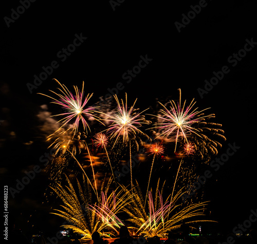 Fireworks show under defocus or blur concepts with isolated black background at night  this celebration is for the International Fireworks Festival in Pattaya on Nov 24-25 in Thailand