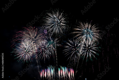 Fireworks show under defocus or blur concepts with isolated black background at night, this celebration is for the International Fireworks Festival in Pattaya on Nov 24-25 in Thailand