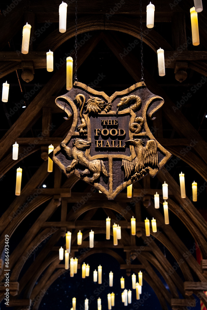 Fototapeta premium JAPAN - Nov 13, 2023: The Food Hall signage logo with lamp lights decoration in Hogwarts Wizarding World at Warner Bros. Studio Tour Tokyo, The Making of Harry Potter