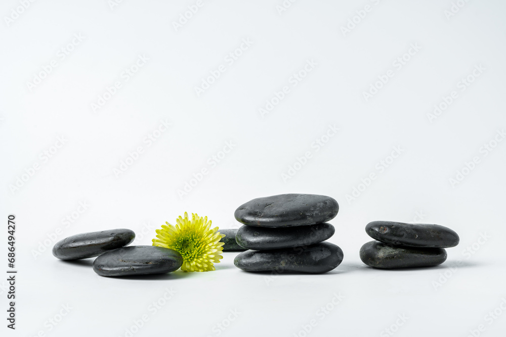 Spa stones and flowers on the white background Spa stones and flowers on the white background