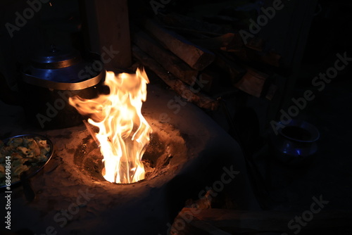 a traditional stove buring the fire in a Gurung village in Ghandruk town for keep warming. Gandaki Province of Nepal, is a point of Annapurna circuit trek and Poonhill trekking in Nepal 