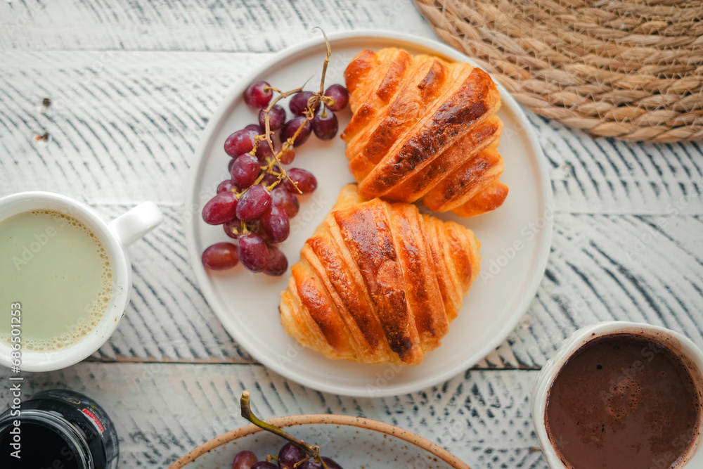 Breakfast: croissants, yogurt, fruit and coffee. Breakfast: croissants, yogurt, fruit and coffee.