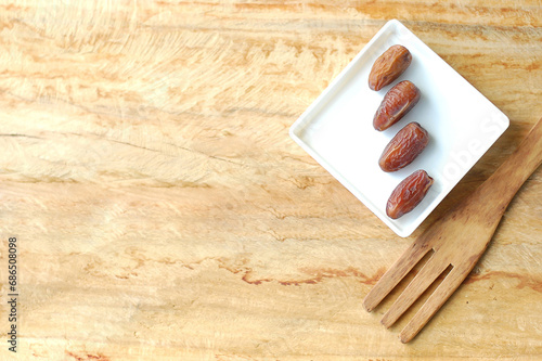 Sweet Dates on Wooden Background. Ramadan and Eid Mubarak Special Traditional Middle East Arab Traditional Dates for Iftar.