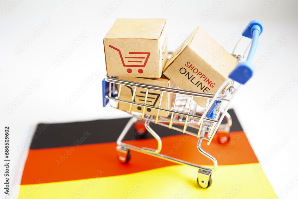 Online shopping, Shopping cart box on Germany flag, import export, finance commerce.
