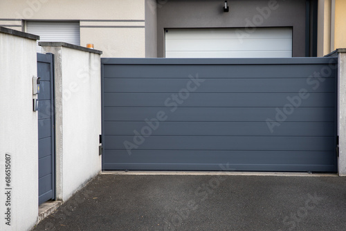 Aluminum door steel dark gray metal house gate street portal of suburb access home photo