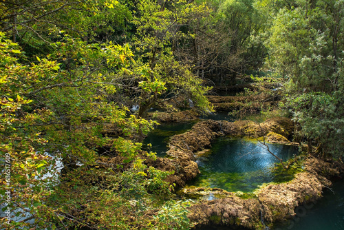 Travertine pools in the River Una at the Small Waterfalls at Martin Brod in Una-Sana Canton, Federation of Bosnia and Herzegovina. Located within the Una National Park. Early September