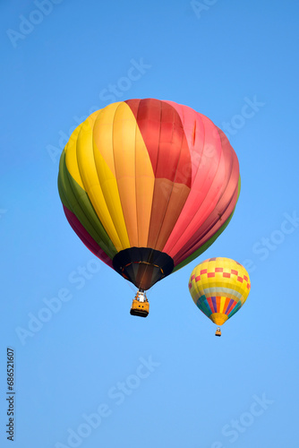 Colorful balloon over blue sky in the bright sun light. © areeya_ann