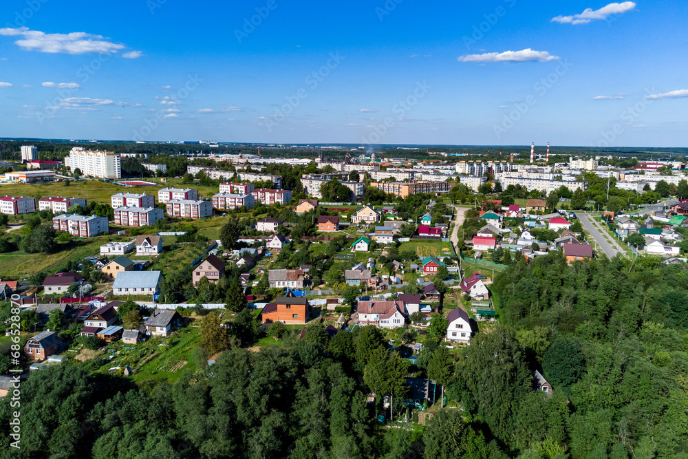 A drone view of the outskirts of an urban area with low- and mid-rise residential buildings. Balabanovo city, Kaluga region, Russia