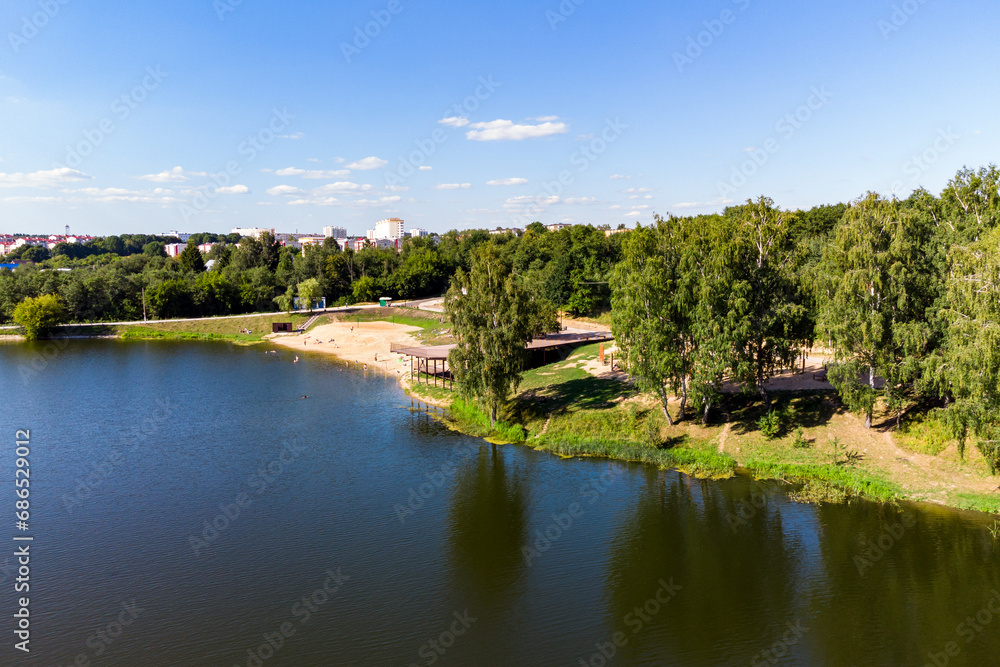 Equipped city beach on a pond on the Stradalovka River in the city of Balabanovo, Russia. Aerial view