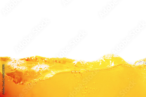 Orange juice with bubbles isolated on a white background. Close-up. photo