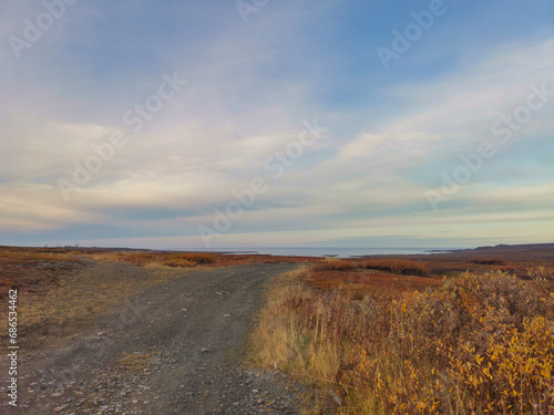 The rocky coast of the Barents Sea. Beautiful view of the rocks and the coast of the Rybachy and Sredny peninsulas  Murmansk region  Russia. The landscape is the harsh beauty of the north.