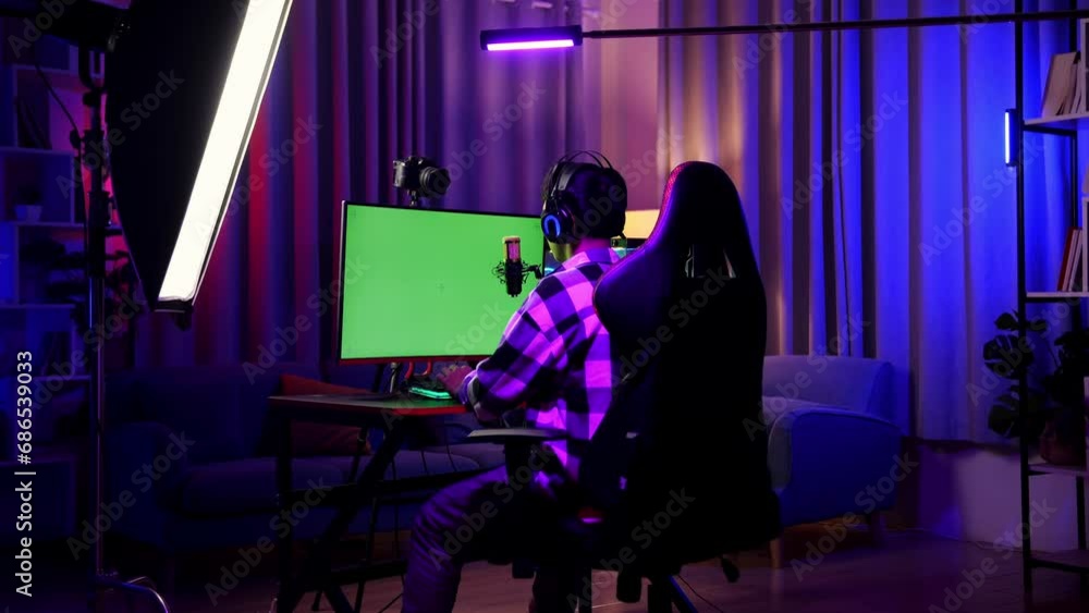 Asian Boy Streamer Celebrating Winning Game On Green Screen Computer
Asian Boy Streamer Celebrating Winning Game On Green Screen Computer