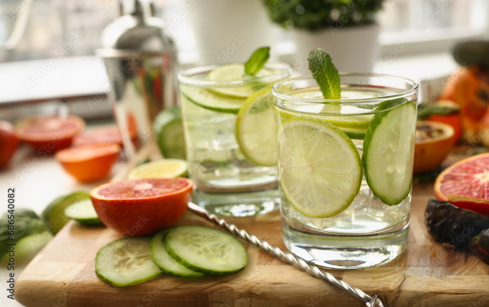 Lime with cucumber punch and mint homemade cocktail closeup. Chilled summer cocktail concept Lime with cucumber punch and mint homemade cocktail closeup. Chilled summer cocktail concept