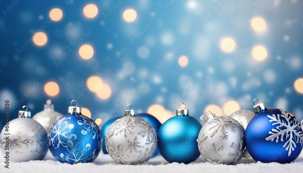 Fototapeta premium Blue christmas balls with snowflakes on bokeh background