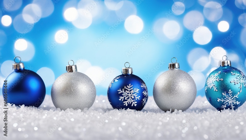 Blue christmas balls with snowflakes on bokeh background Blue christmas balls with snowflakes on bokeh background