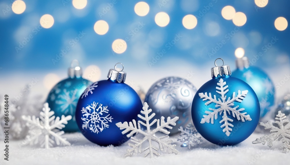 Blue christmas balls with snowflakes on bokeh background Blue christmas balls with snowflakes on bokeh background