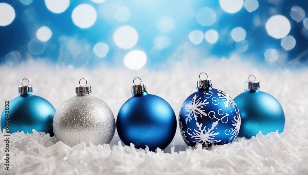Blue christmas balls with snowflakes on bokeh background Blue christmas balls with snowflakes on bokeh background