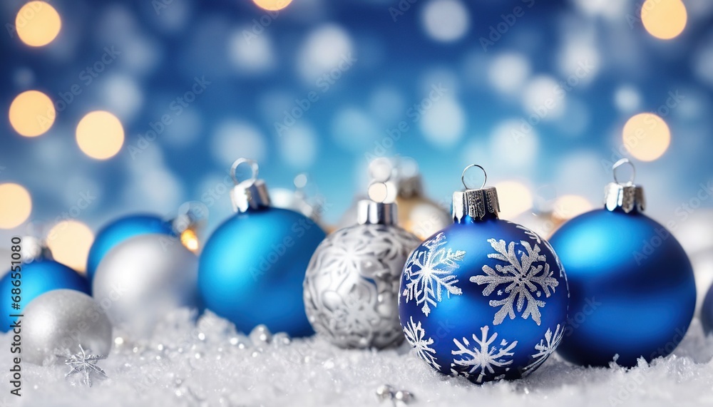 Blue christmas balls with snowflakes on bokeh background Blue christmas balls with snowflakes on bokeh background