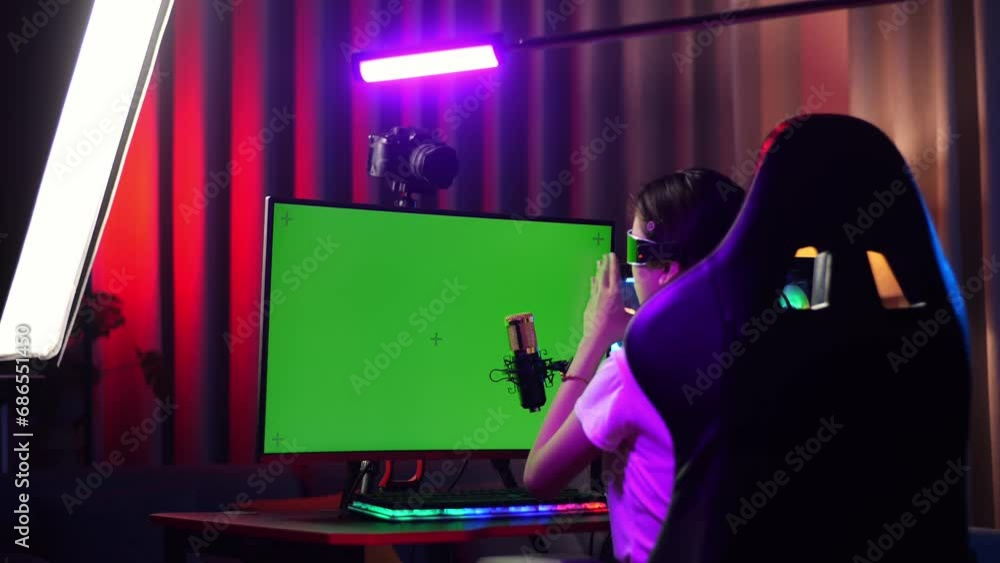 Asian Girl Streamer Lives Stream Playing Game On Computer, Talks On Microphone
Asian Girl Streamer Lives Stream Playing Game On Computer, Talks On Microphone