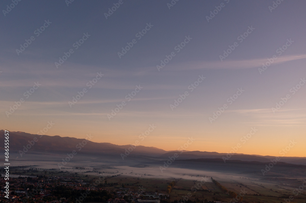 aerial view of foggy morning autumn mountains with clouds bansko bulgaria