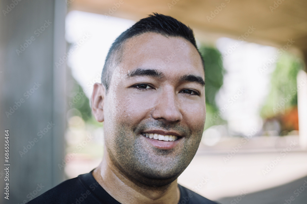 Portrait of smiling man with sweat on face after working out Portrait of smiling man with sweat on face after working out