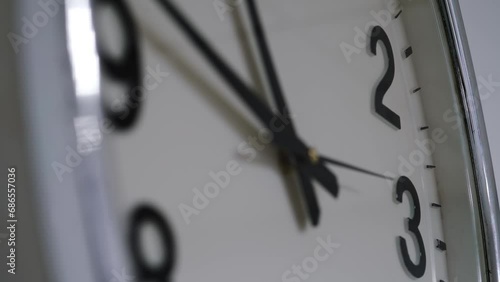 round white stylish watch with black hands. A close-up of the second hand counts the time.
the concept of endless time.
clock in the office of the corporation.
being late for work or studies deadlines