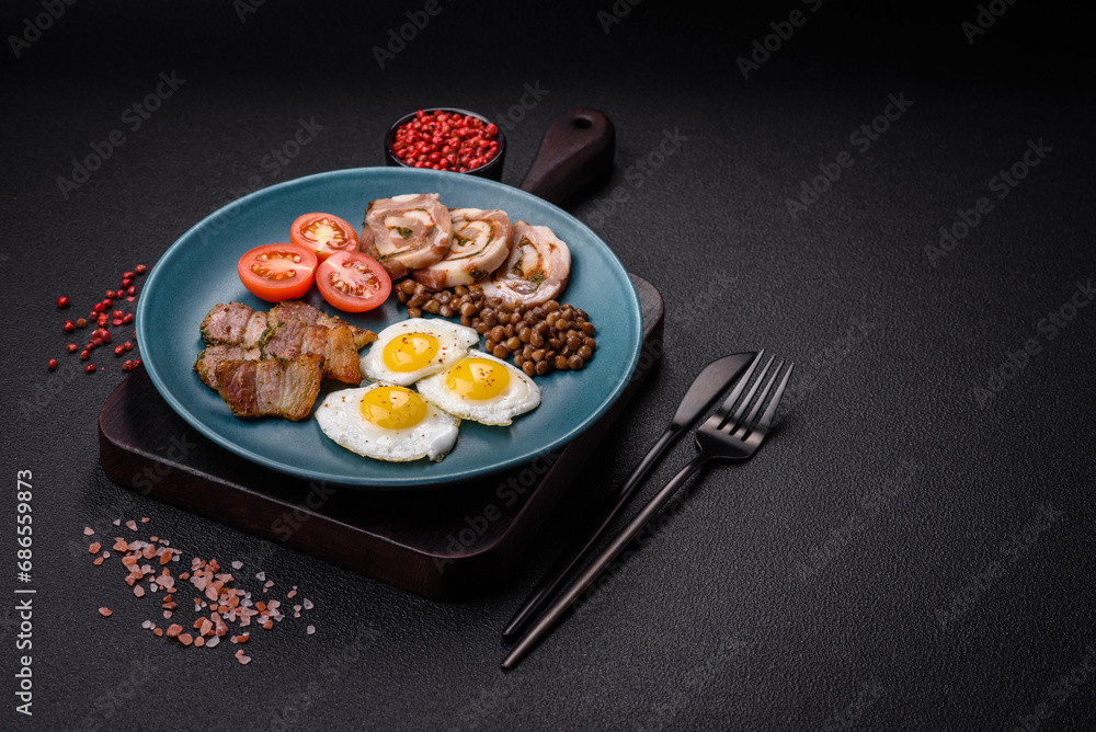 Delicious nutritious breakfast of fried quail eggs, bacon, legumes and cherry tomatoes Delicious nutritious breakfast of fried quail eggs, bacon, legumes and cherry tomatoes