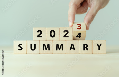 2023 year summary text on wooden cube blocks on smart grey background. Past performance analysis for learning and  improvement. Preparation for annual plan in 2024. End of year concept. photo