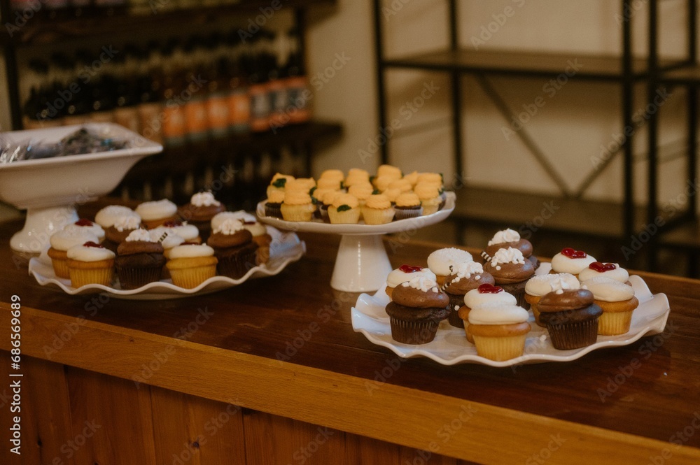 Array of freshly baked cupcakes displayed on a countertop